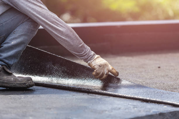 Professional Basement Waterproofing technician working in Burlington, NC